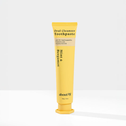 yellow natural hydroxyapatite toothpaste tube, brand is About28 Oral Cleanser mint and bergamot flavour
