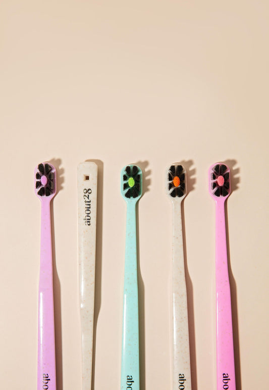 colourful toothbrushes with black bristles