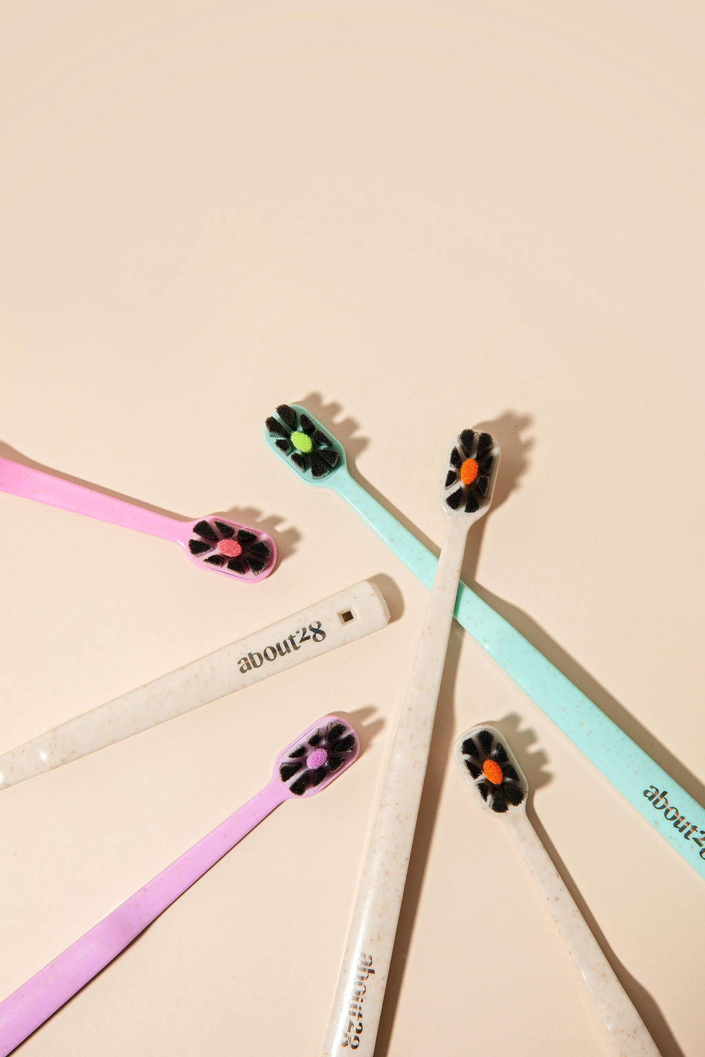 colourful toothbrushes with black bristles