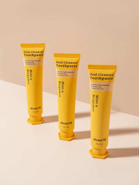three natural hydroxyapatite toothpaste tubes, brand is About28 Oral Cleanser, mint and bergamot flavour fluoride-free